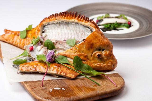 Baked bream with wilted spinach, radish and nero sauce